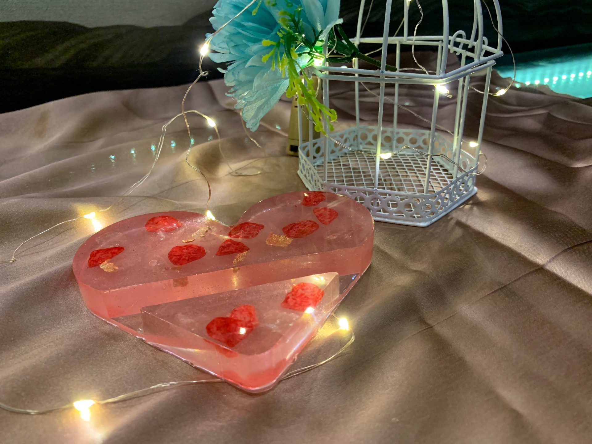 Pink heart-shaped resin tray with strawberry hearts and gold flakes