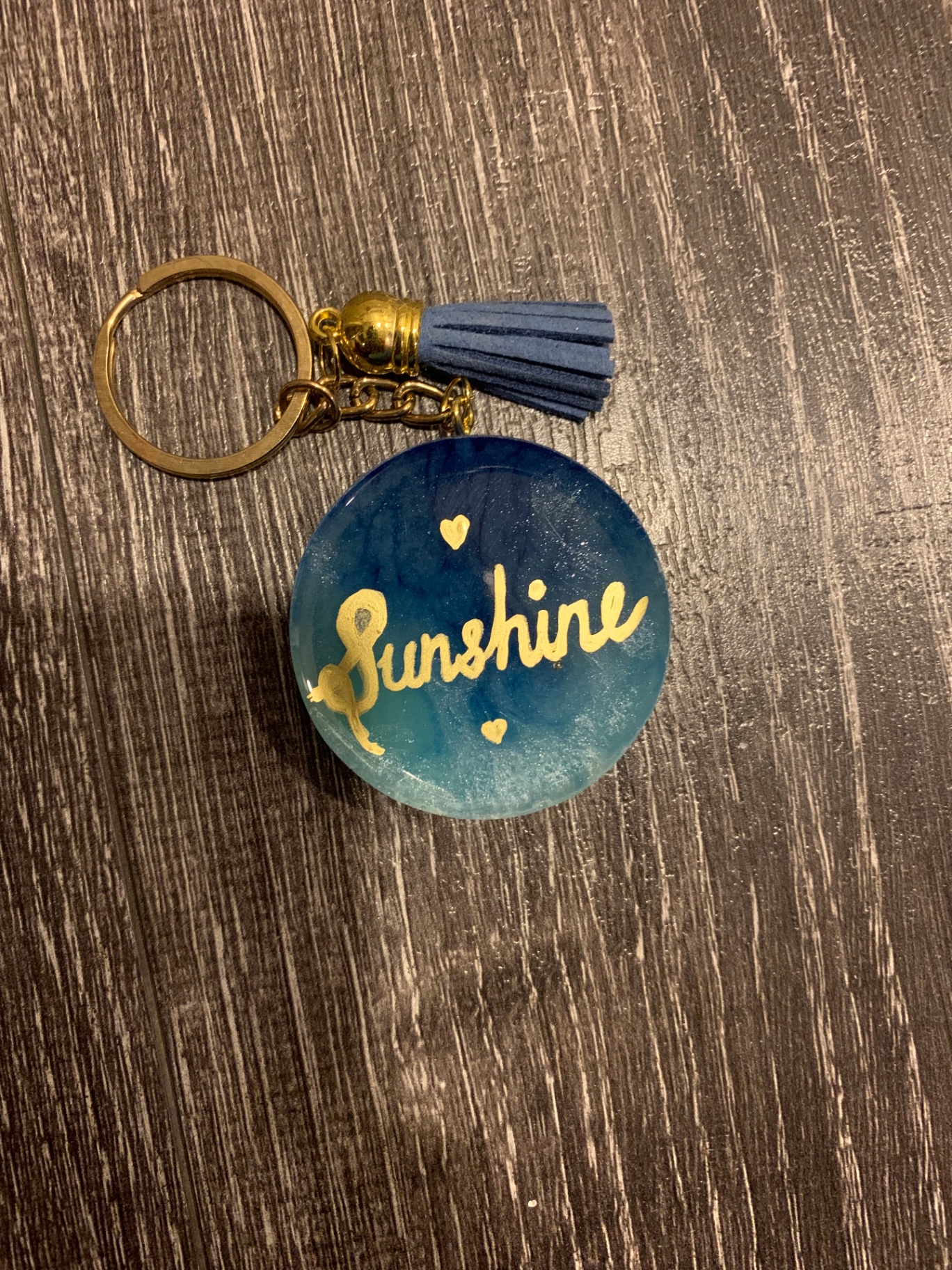 Blue resin sunshine keychain with denim tassel
