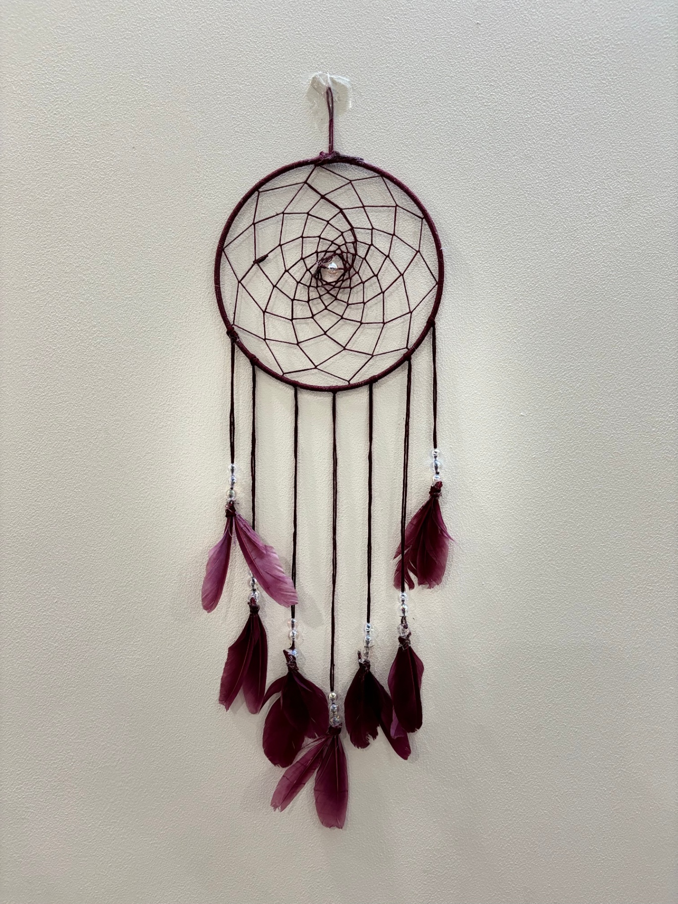 Maroon dream catcher with deep wine feathers and silver beads